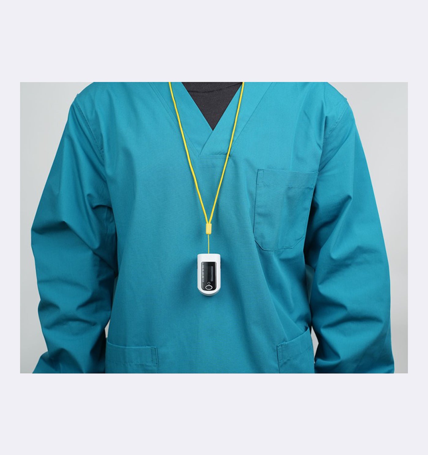Teal scrub top with a yellow lanyard and badge on a light gray background