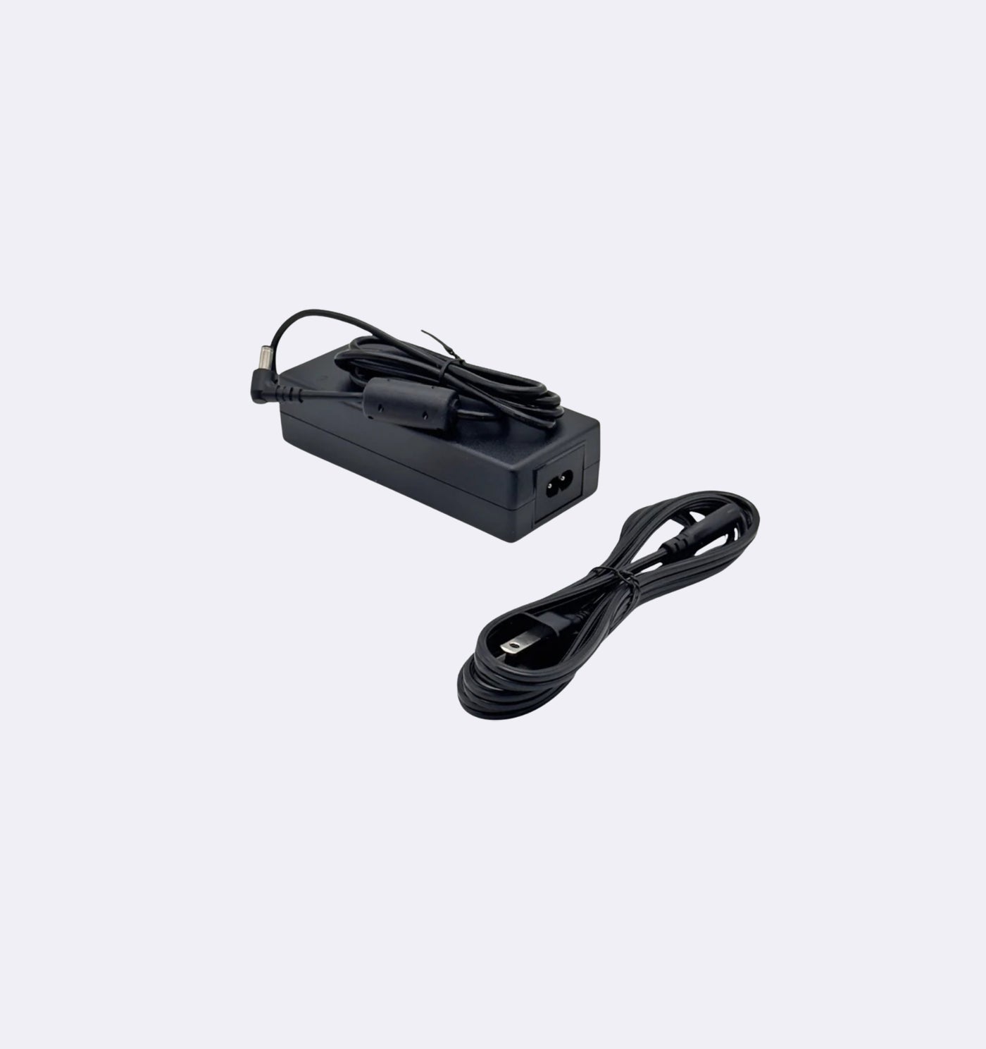Black power adapter with cable on a light gray background
