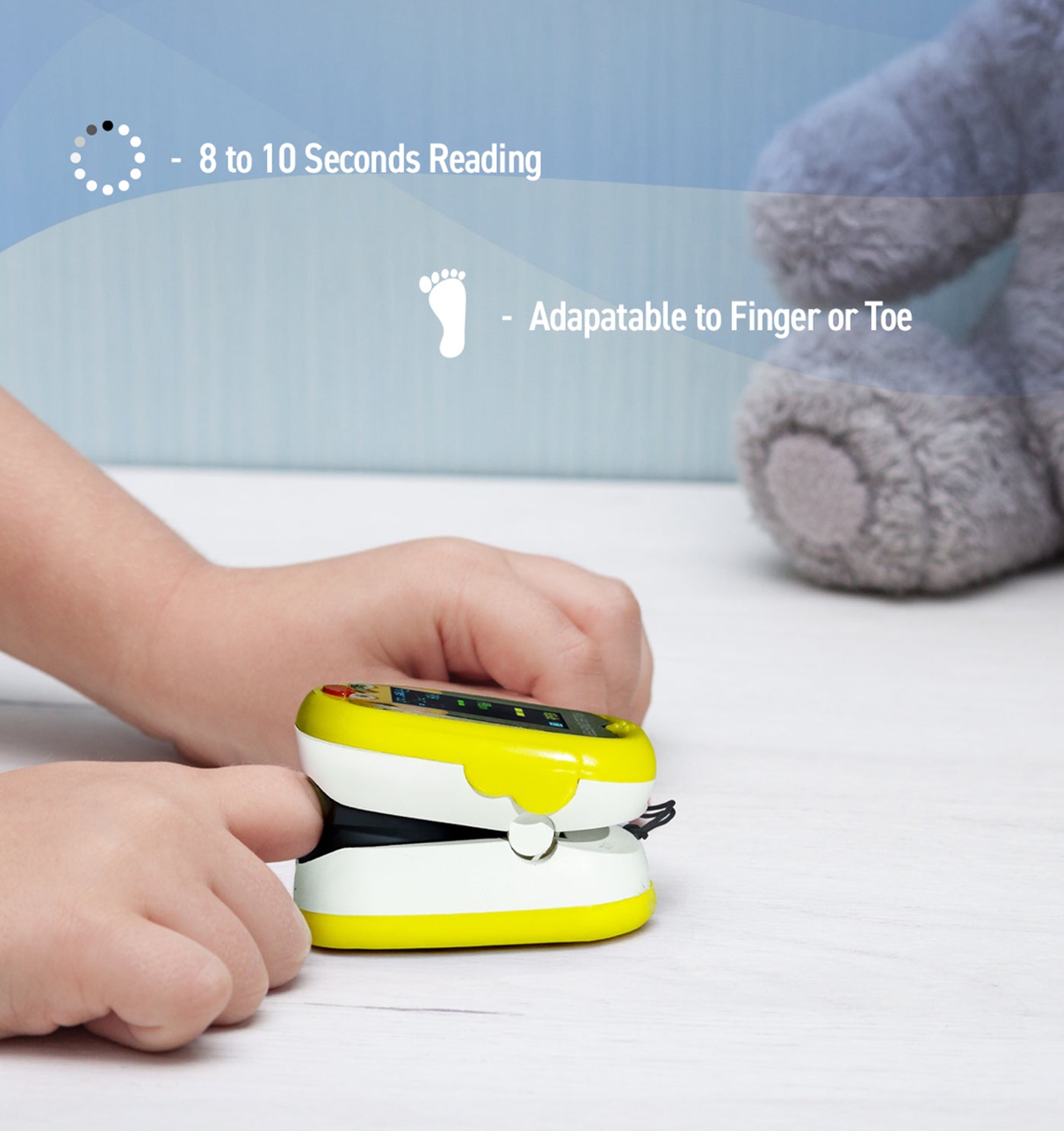 Yellow and white device on a child's hand with text about reading speed and adaptability to finger or toe.