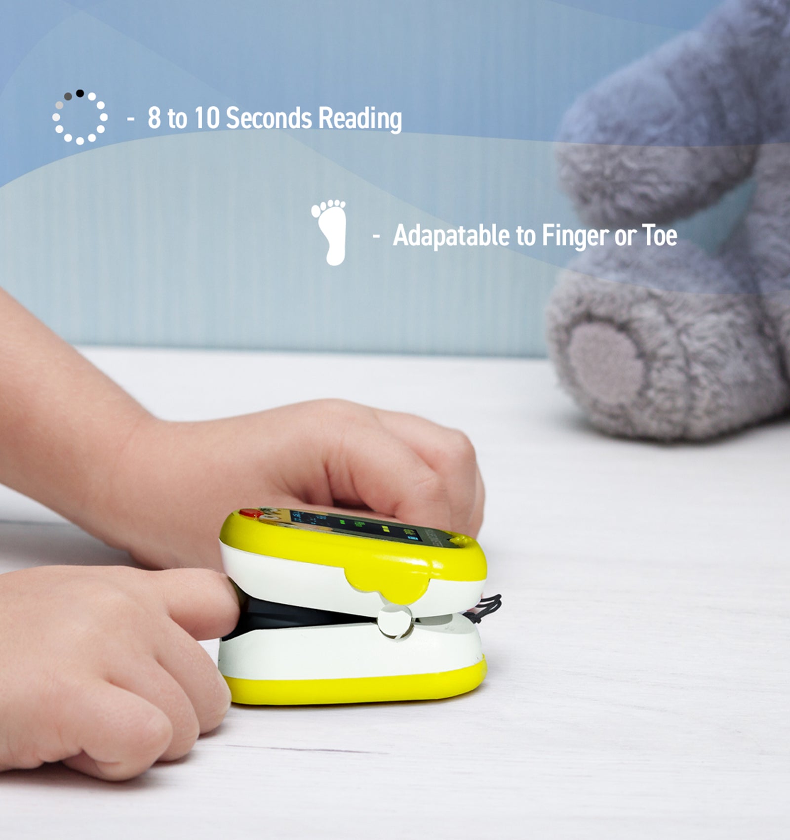 Yellow and white device on a child's hand with text about reading speed and adaptability to finger or toe.