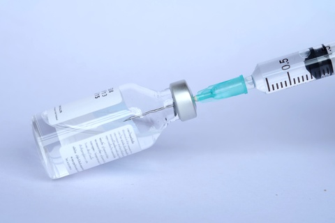 vaccine bottle and needle