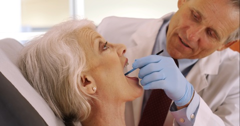 elderly woman visiting the dentist