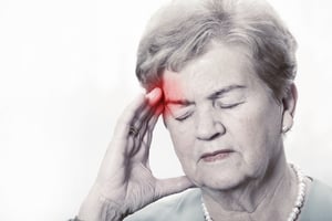 elderly woman with headache